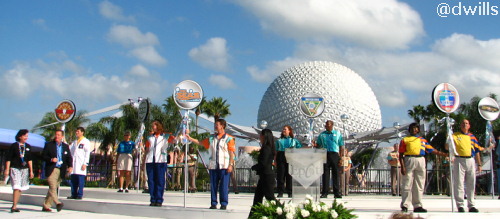 Erin Wallace and Jim MacPhee walk on stage.