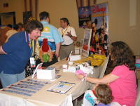 Deanna Mongello at the WDW Trivia book table (Lou is in the background)